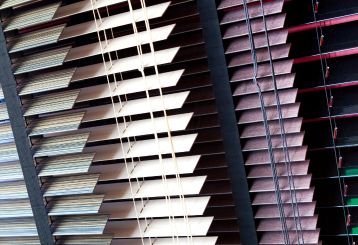 Modern mini blinds adding a touch of elegance to a living room in Santa Monica.