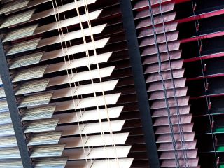 Modern mini blinds adding a touch of elegance to a living room in Santa Monica.